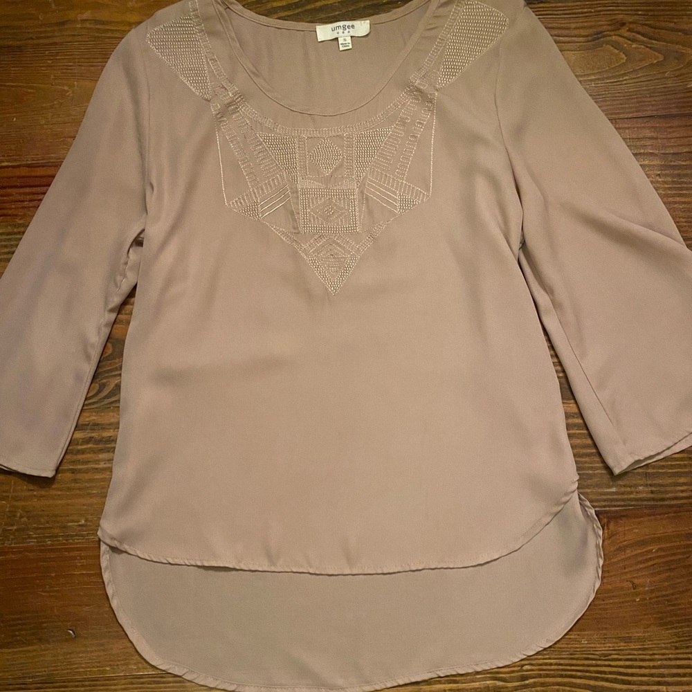 Umgee blouse with detailed stitching at neck.